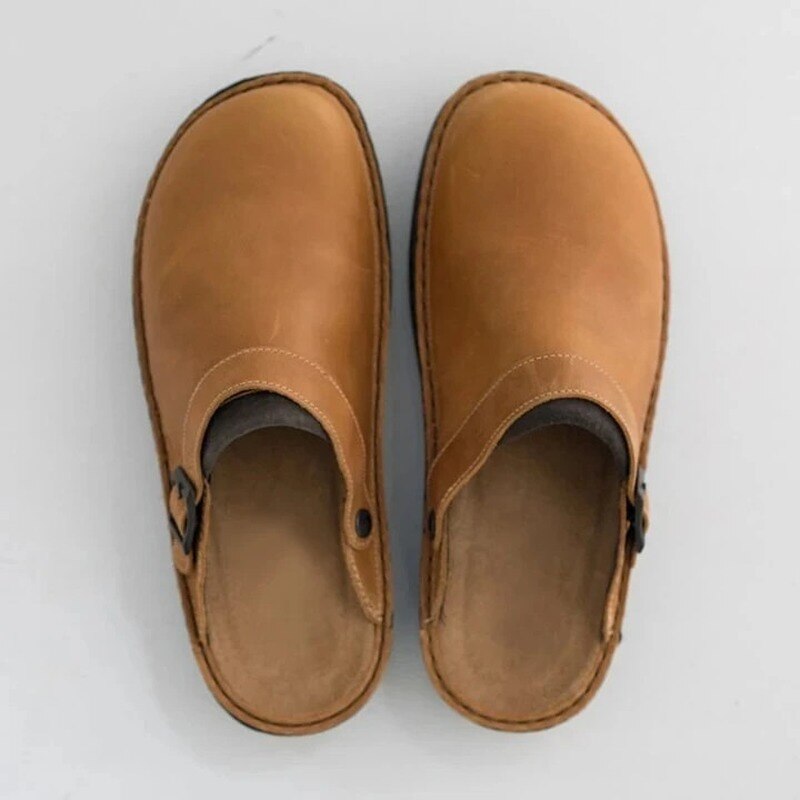 Pair of khaki buckle-strap clog slippers from above