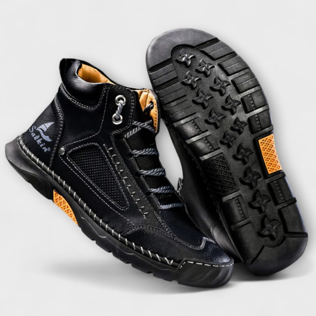 Black lug-sole stitched ankle boots and lug sole