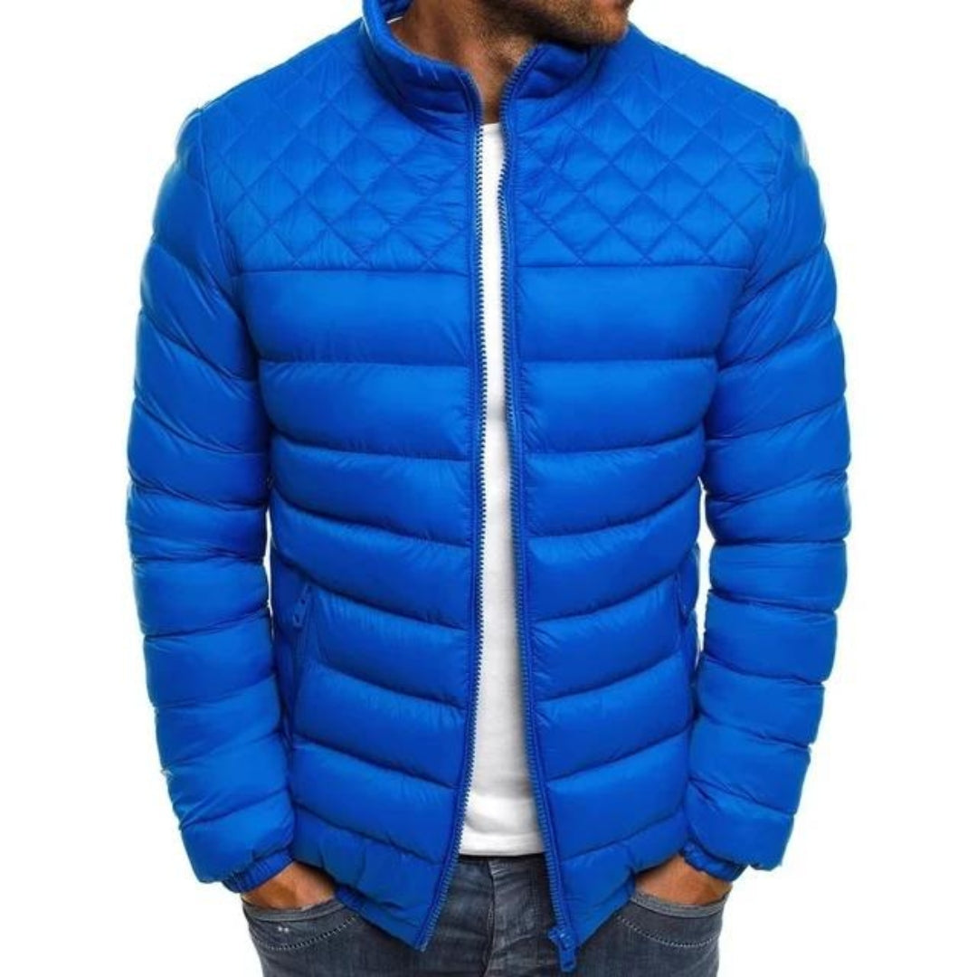Man wearing a blue quilted-yoke puffer jacket