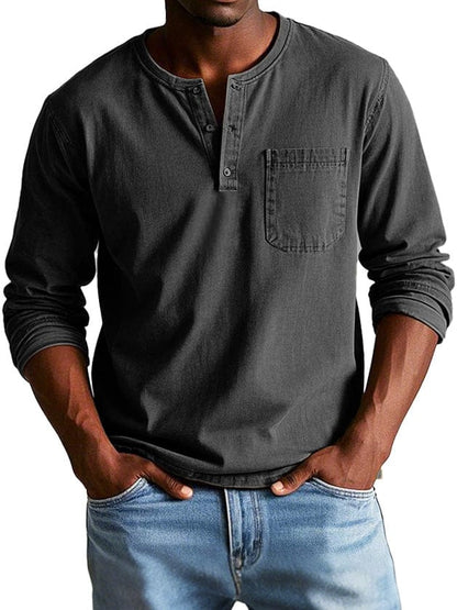 Man wearing a black chest pocket henley shirt