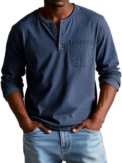 Man wearing a navy blue chest pocket henley shirt