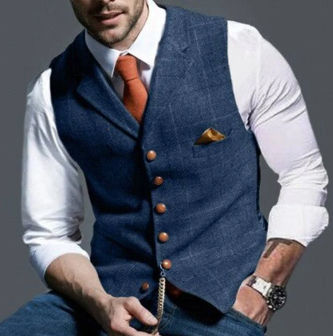 Blue notch-lapel plaid vest worn over a white shirt and tie