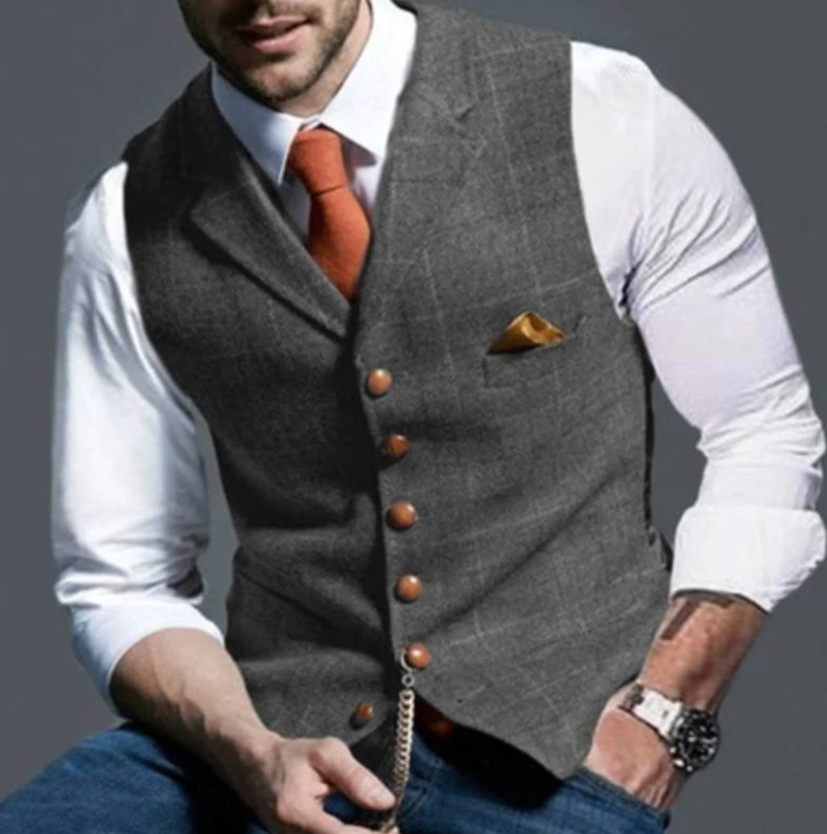 Gray notch-lapel plaid vest worn over a white shirt and tie
