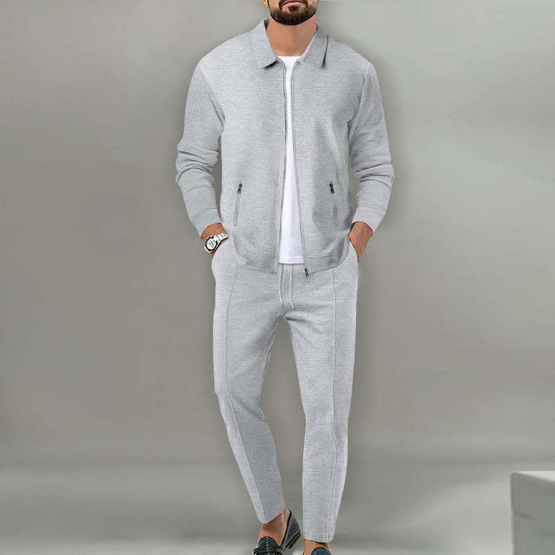 Gray waffle-knit zip jacket and drawstring pants set worn over a white T-shirt