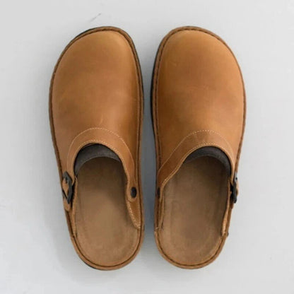 Pair of khaki buckle-strap clog slippers from above