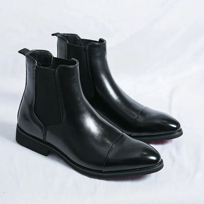 Pair of black cap-toe Chelsea boots with elastic side panels
