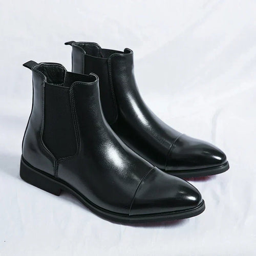 Pair of black cap-toe Chelsea boots with elastic side panels