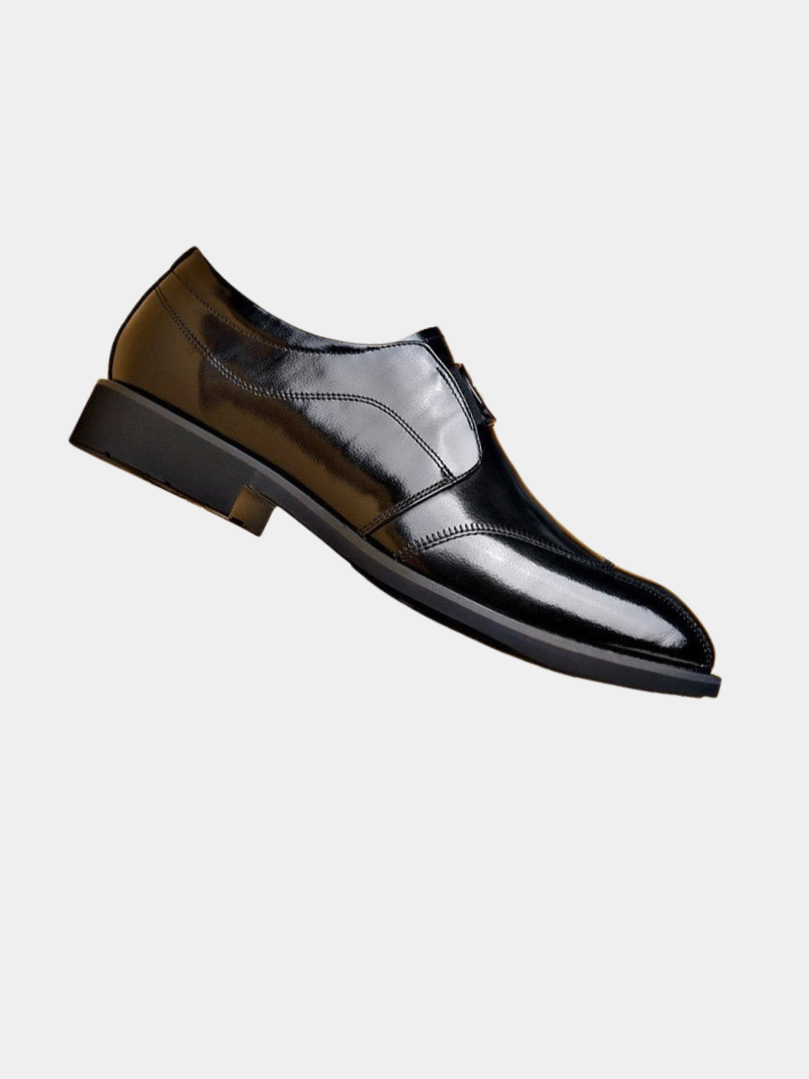 Black wingtip bit loafer, side view on a white background