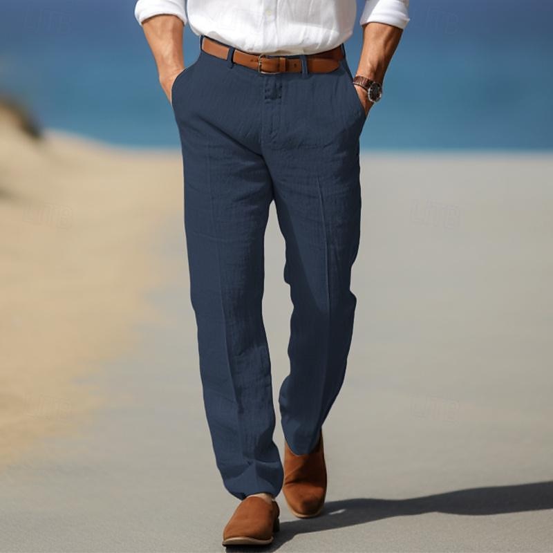 Man wearing navy blue linen-look straight-leg pants on the beach