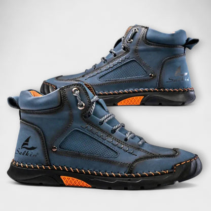 Pair of blue lug-sole stitched ankle boots