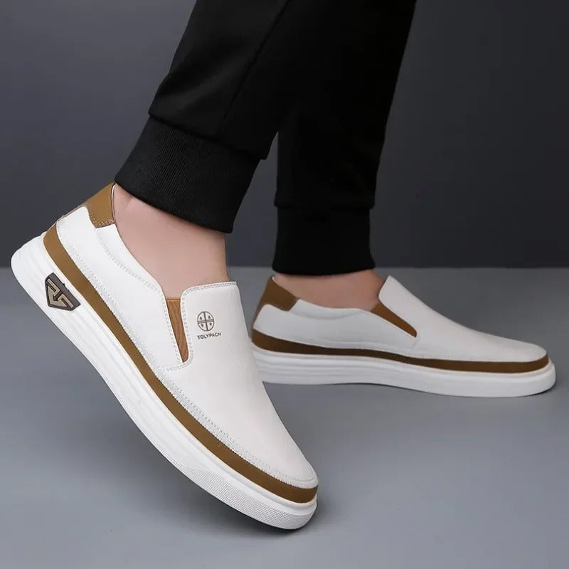Man wearing white contrast-stripe slip-on sneakers