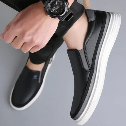 Man wearing black contrast-stripe slip-on sneakers