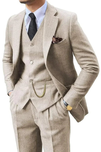 Man wearing a beige herringbone notch-lapel suit